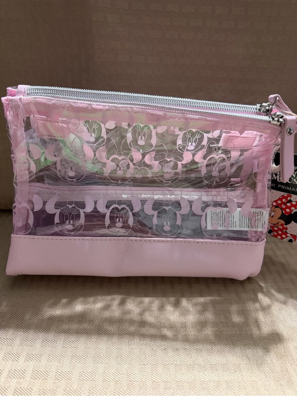 Minnie Mouse Pink Clear Cosmetic Bag “L” monogram on front.